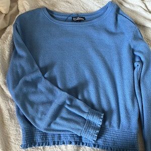 This is a blue, large, flowy blue top.